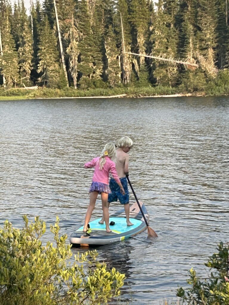This image has an empty alt attribute; its file name is paddle-boarding-768x1024.jpg